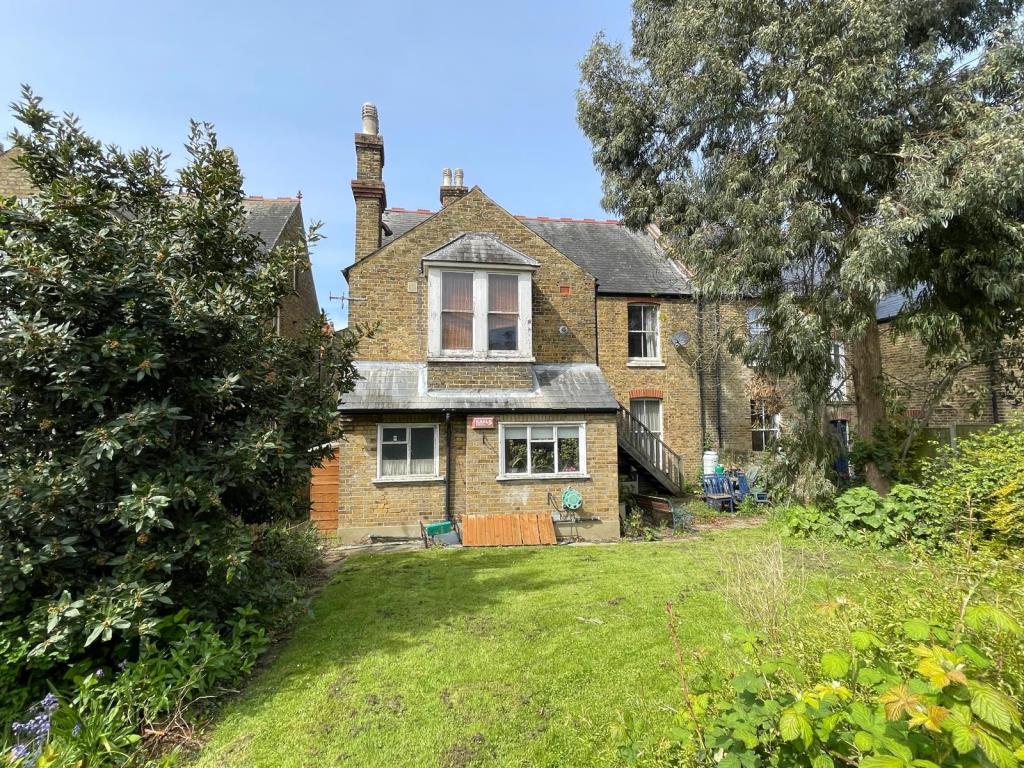 Lot: 37 - FREEHOLD BLOCK TWO LARGE THREE-BEDROOM FLATS - Rear of semi detached block of two flats